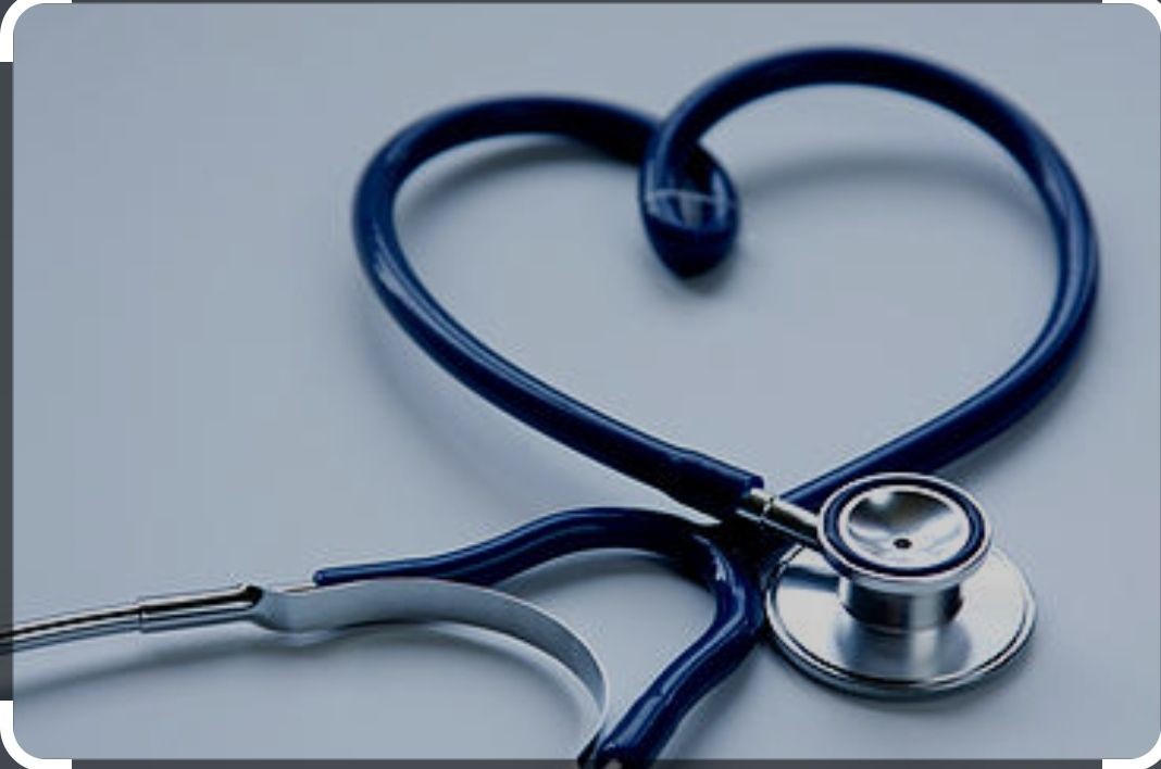 Stethoscope with the tubing arranged in the shape of a heart on a white background.